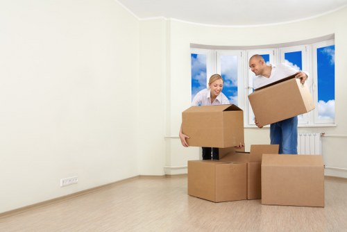 Students arranging storage for boxes and luggage in Harrow